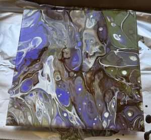 Student fluid art canvas with flowing blue, olive green, brown, and white acrylic paint pouring cells and swirl patterns